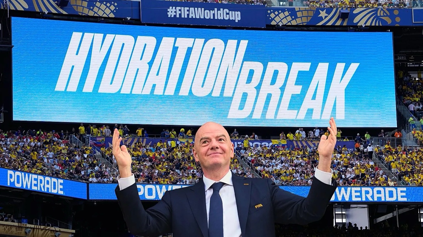 A World Cup stadium big screen reading HYDRATION BREAK, with Powerade hoardings running along the tiers beneath it.